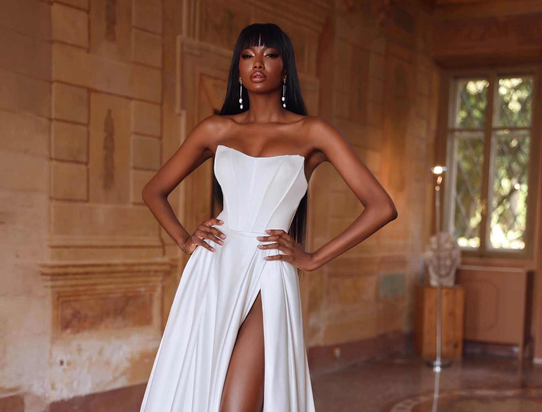 Model wearing a white gown