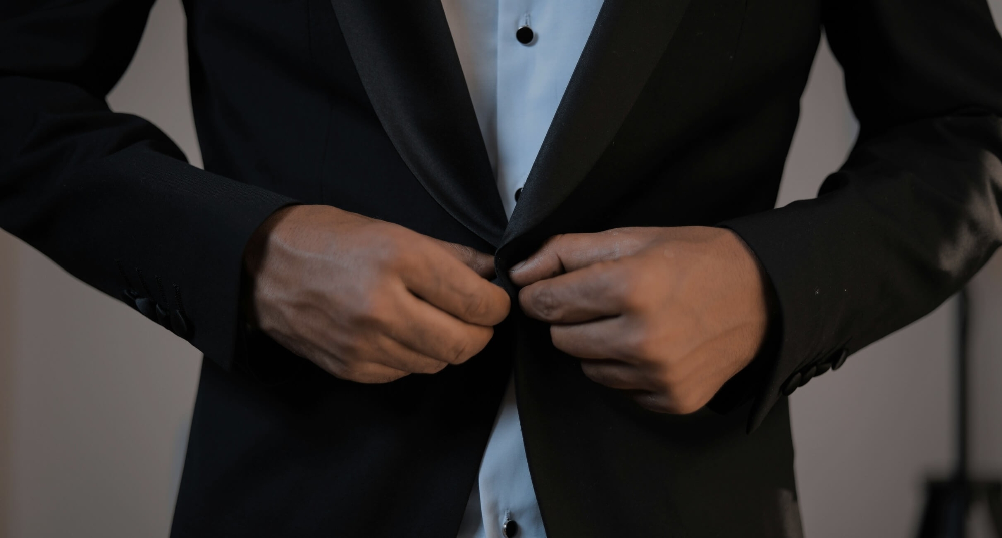 Model wearing a black suit